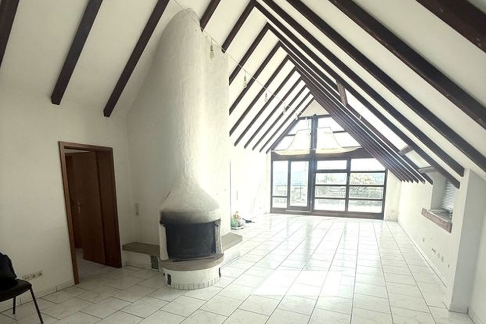 Schoeneaussicht Immobilien
Penthousewohnung im Briller Viertel Wohnzimmer mit Kamin